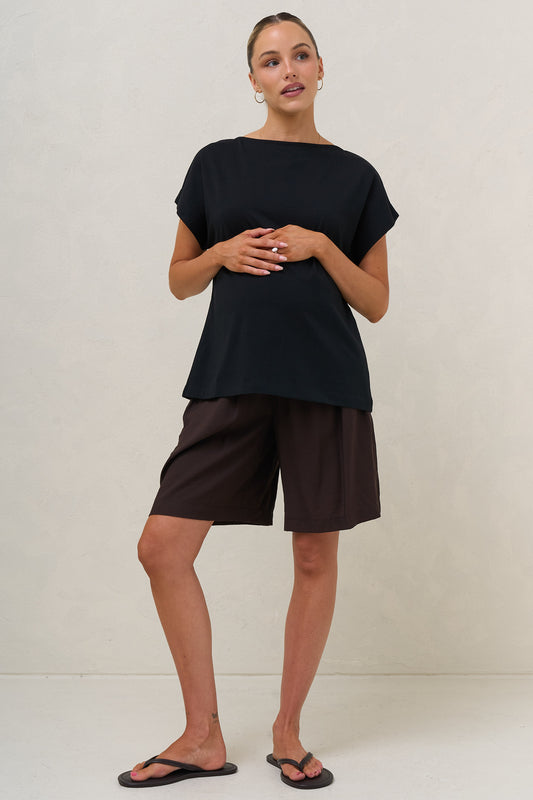 Ruched maternity tee in black – styled with brown shorts