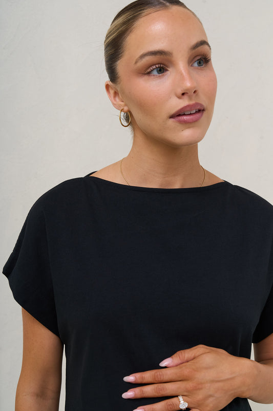Ruched maternity tee in black – close-up of wide neckline