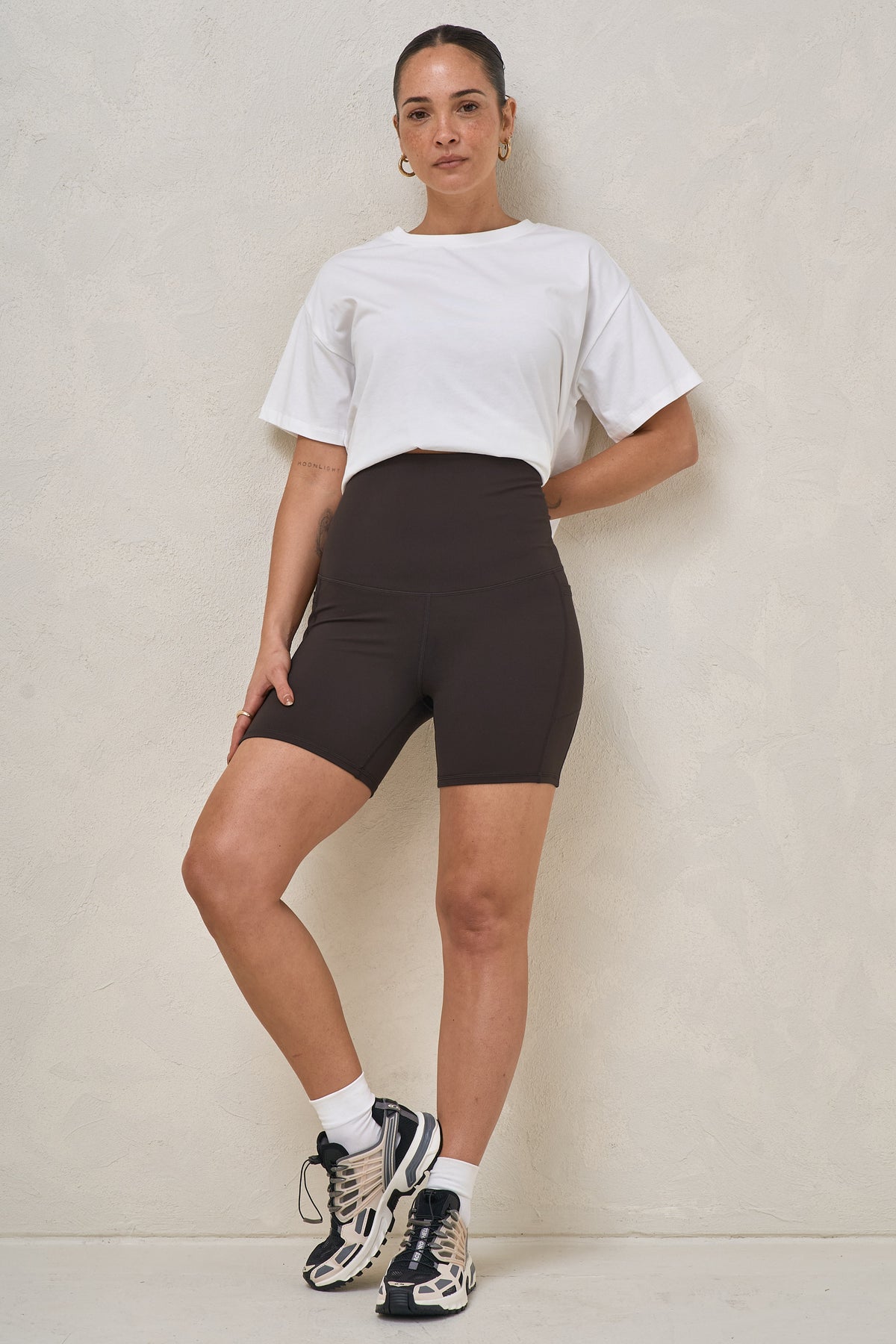 Maternity bike shorts in brown – front view worn post-pregnancy