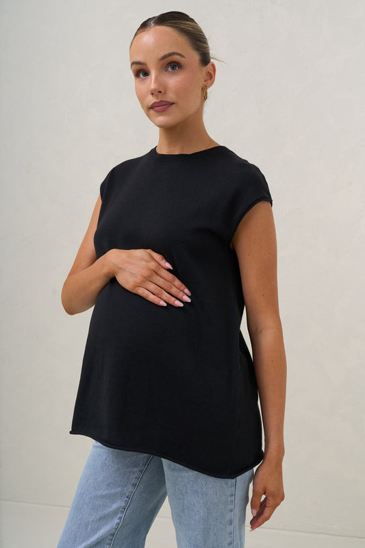 Maternity knit tank in black – front view on bump, styled with light blue jeans